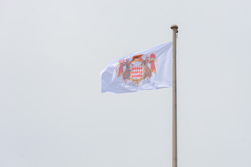 Fototapeta premium flag of Monaco on pole