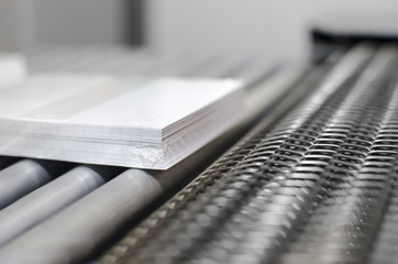 Close up of Paper stuck, book on Factory Conveyor Belt, selective focus dof background