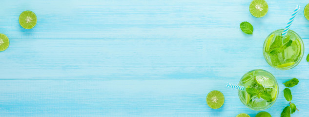 Refreshing Mojito cocktail drinks in the glasses , banner background