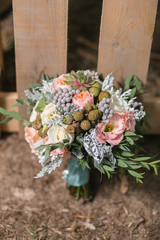 Wedding bouquet different flowers. Modern bridal bunch with poppy flower and succulents.