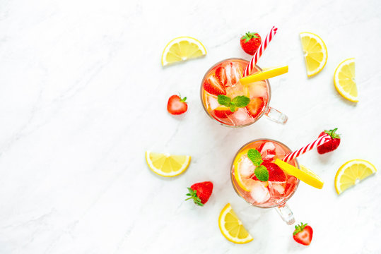 Colorful refreshing strawberry lemonade juice drinks for summer,