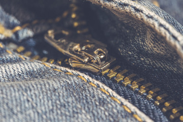 Metal zipper on classic blue jeans. Fashion in the casual style 