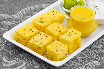 Indian Traditional Street Food Khaman Dhokla Served With Chutney & Chilli