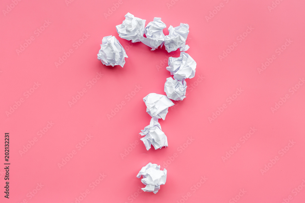 Poster question mark lined with crumpled paper on pink background top view copy space