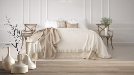 Fototapeta na wymiar Wooden table top or shelf with minimalistic modern vases over blurred minimalistic classic bedroom, white interior design