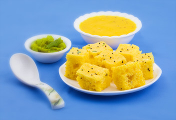 Indian Traditional Street Food Khaman Dhokla Served With Chutney & Chilli