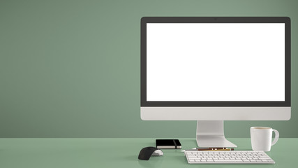 Desktop mockup, template, computer on green work desk with blank screen, keyboard mouse and notepad with pens and pencils, colored pantone colored background