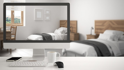 Architect house project concept, desktop computer on white work desk showing scandinavian white bedroom, minimalistic blurred interior design in the background