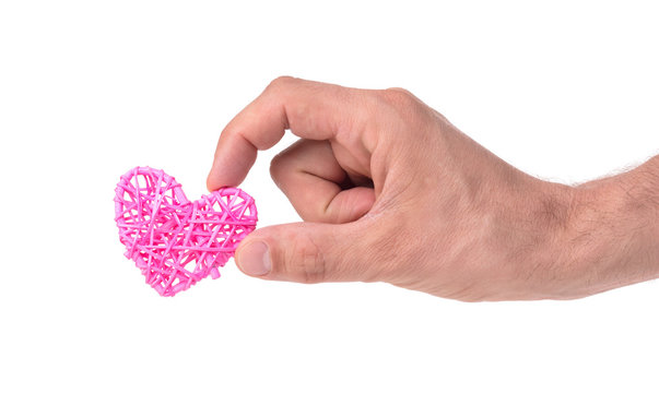Adult male hand holding a small heart isolated