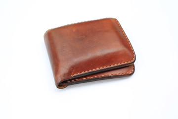 Brown leather wallet isolated on white background.
