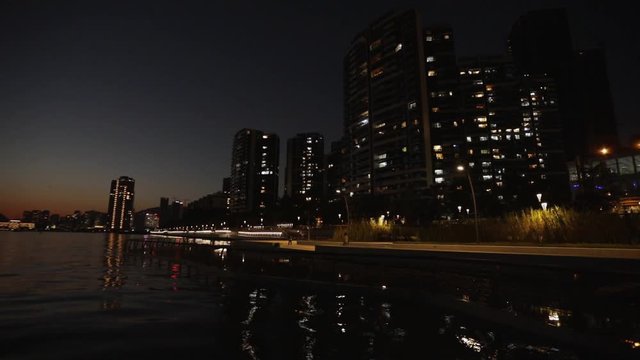 Shenzhen - Shekou, China, at night. Skyscrapers reflecting at sea surface