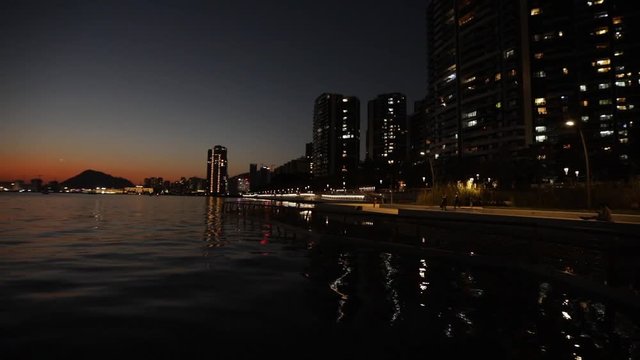 Shenzhen - Shekou, China, at night. Skyscrapers reflecting at sea surface
