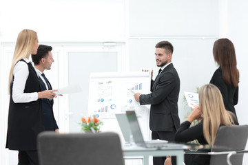 businessman makes a presentation to his business team