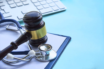 Gavel and stethoscope. medical jurisprudence. legal definition of medical malpractice. attorney....