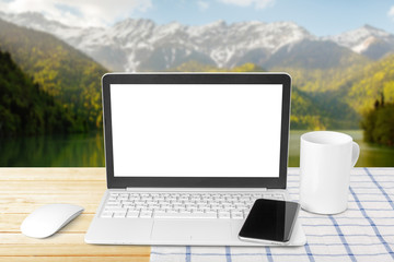 Fototapeta premium Laptop with blank screen on table