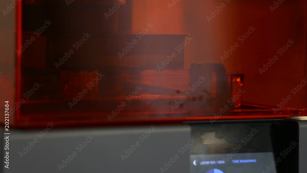 Poster a 3d printer in the laboratory prints a structure from a photopolymer
