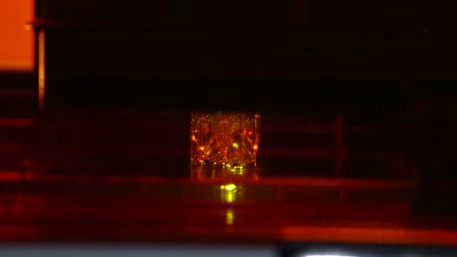 A 3d printer in the laboratory prints a structure from a photopolymer