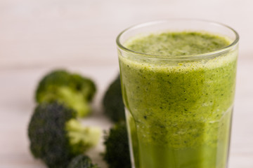 fresh broccoli juice on a wooden background
