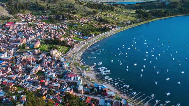 Timelapse of the town of Copacabana and the lake of Titicaca, Bolivia. Zoom out day to night time lapse