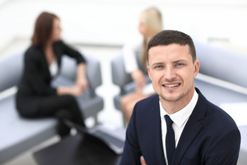 successful businessman on blurred background office