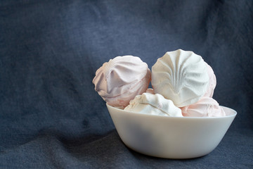 Obraz premium White zephyr marshmallow on porcelain plate