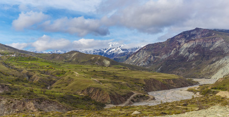 The riverbed of the Girdimanchay River and a view of the snow-capped mountains of the Ismaili Reserve