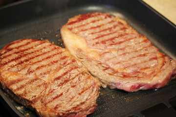 Two steaks cooked on the pan