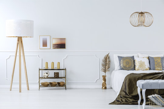 Golden decorations in luxurious bedroom