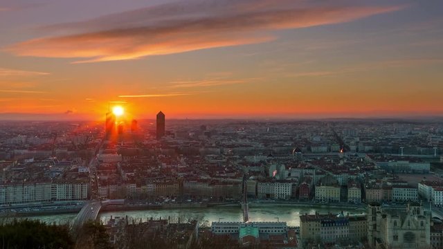 sun rising over lyon city skyline timelapse from night to day aerial view