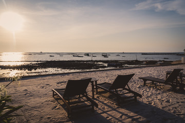 Beach bed with sunset in twilight time.