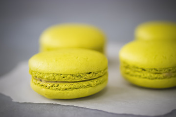 Macaroni cakes on gray background. Copy space.