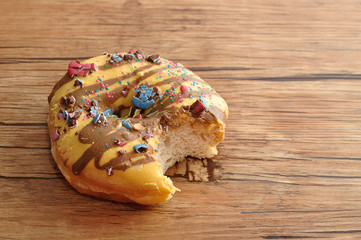 A doughnut with a bite taken out