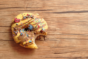 A doughnut with a bite taken out