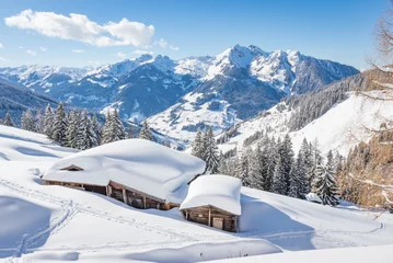 Gartenposter Beautiful winter mountain landscape with snowcapped wooden hut © mRGB