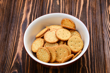 Crackers on a wooden background.