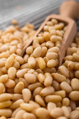 peeled pine nuts on a rustic background