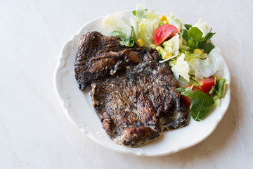 Turkey Meat Entrecote Steak with Cream Sauce and Salad.