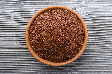 flaxseed and oil on a rustic background