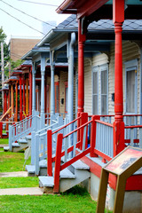 Fototapeta na wymiar A row of colorful wooden porches verandas
