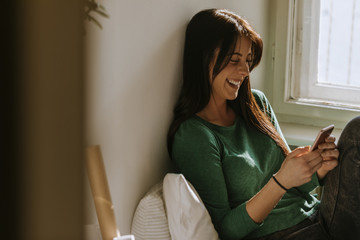 A Young Girl Using A Smartphone