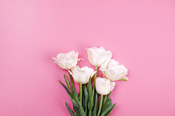 Beautiful spring holidays flowers arrangment. Bunch of white tulips in festive composition, copy space for text, white background.