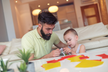 Obraz premium Father and son playing at home