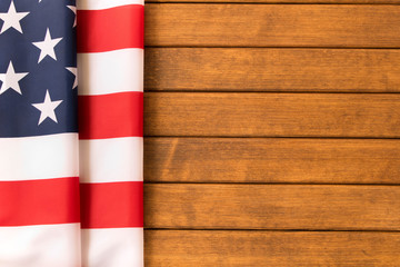 Fototapeta na wymiar American flag on wooden background . Independence day celebration. July 4th
