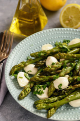 Asparagus with mozzarella cheese and lemon dressing. 