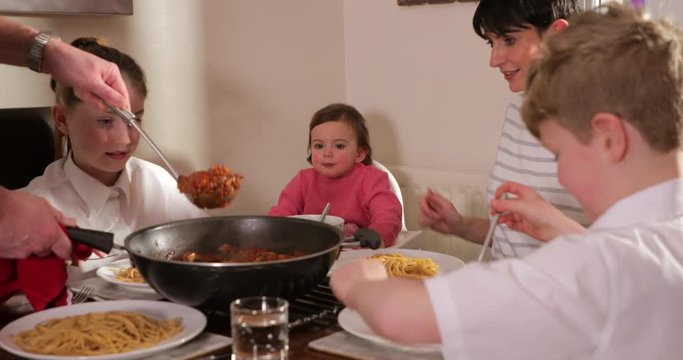 Family Enjoying Bolognese at Home