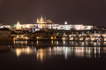 Fototapeta na wymiar Stunning night view of the Prague castle and the famous Charles bridge over the vltava river in Prague, Czech Republic capital city.