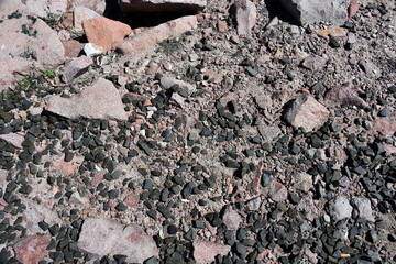 Made from pebble gravel stones different shape as floor texture background. Small rocks background texture, abstract stone texture pebbles.