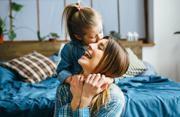 Daughter hugs her Mom.
