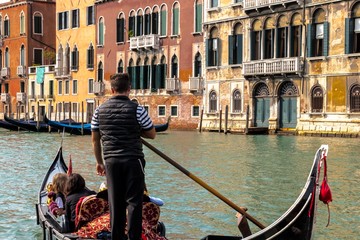 Fototapeta na wymiar Venice - A romantic gondola ride on the Grand Canal of the Venice Lagoon in Italy.