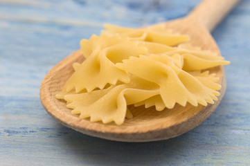 Italian pasta on a wooden table. 